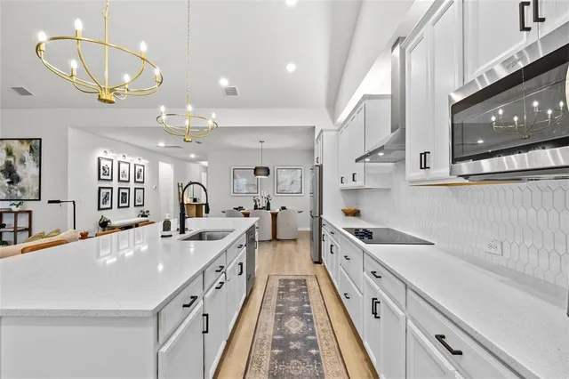 a bathroom with a toilet a sink and a bathtub