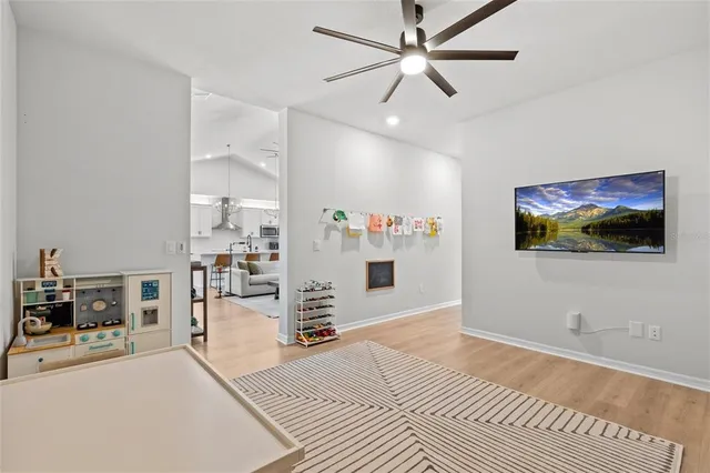 a kitchen with stainless steel appliances a refrigerator sink and wooden cabinets