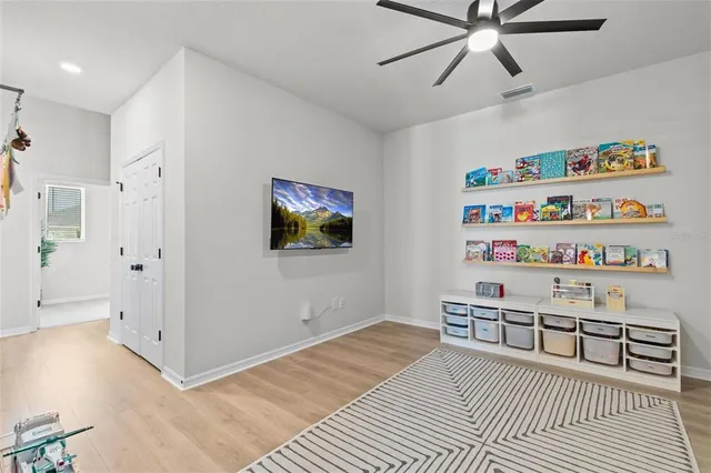 a view of a house with backyard porch and sitting area