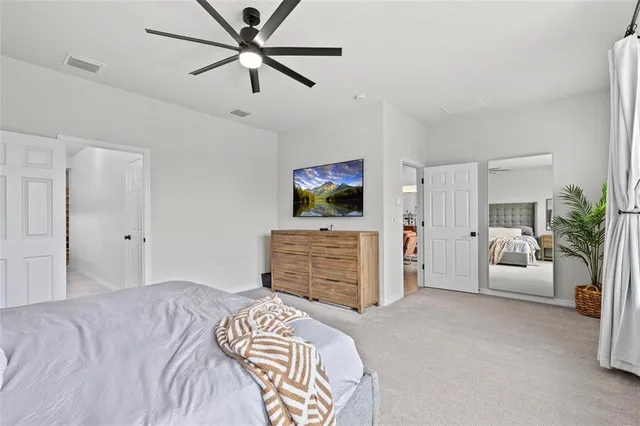 a view of a patio with a table and chairs