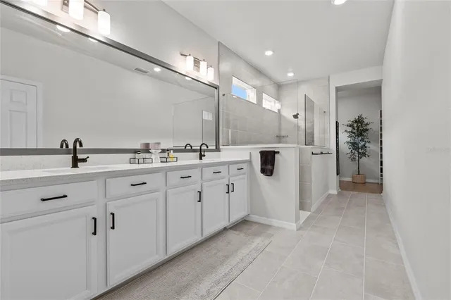a view of a porch with a table and chairs