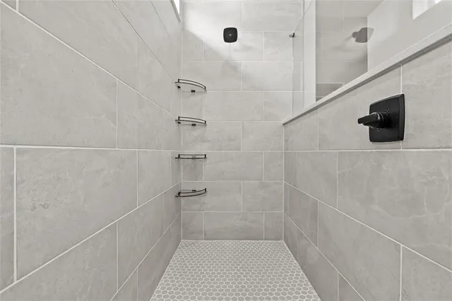 a view of a chair and tables in the patio