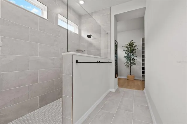 a view of a patio with a table chairs and a potted plant
