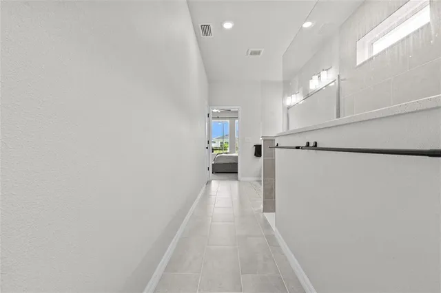 an aerial view of residential houses with yard