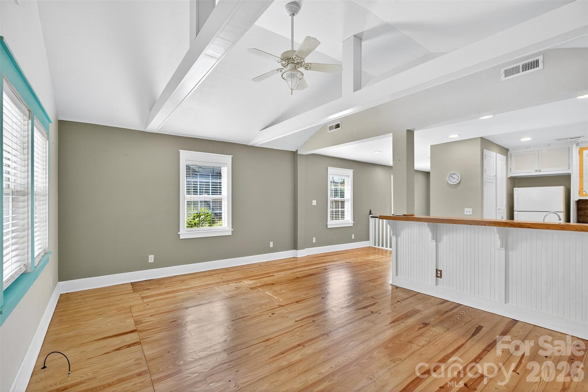 160 East Howard Street Tryon, NC 28782 - Photo 8 of 48 a view of an empty room with window and wooden floor