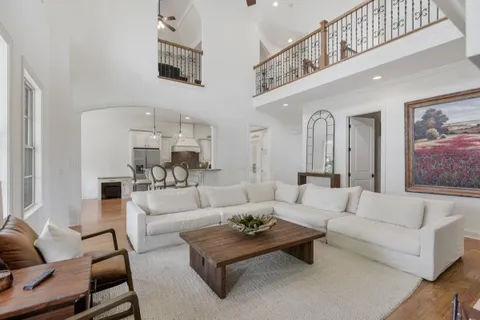 a kitchen with sink stove and cabinets