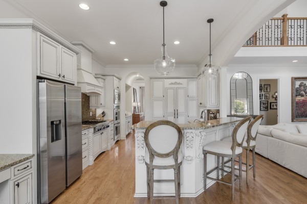 2228 B Highway 25 Cottontown, TN 37048 - Photo 24 of 61 a kitchen with stainless steel appliances a refrigerator a sink a stove and white cabinets with wooden floor