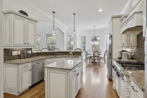 a room with a book shelf and wooden shelves