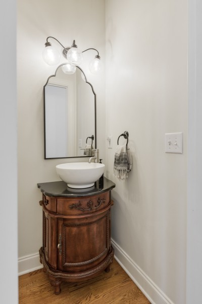 2228 B Highway 25 Cottontown, TN 37048 - Photo 29 of 61 a bathroom with a sink and mirror