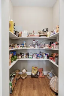 a large bathroom with a tub sink and mirror