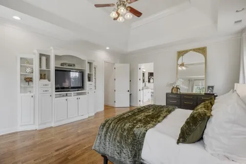 a very nice looking room with a large window and a chandelier