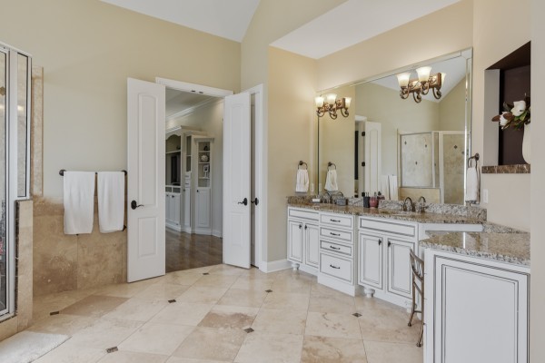 2228 B Highway 25 Cottontown, TN 37048 - Photo 36 of 61 a bathroom with a granite countertop sink a mirror and a shower