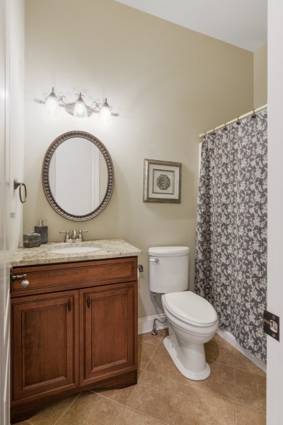 2228 B Highway 25 Cottontown, TN 37048 - Photo 43 of 61 a bathroom with a granite countertop toilet sink and mirror