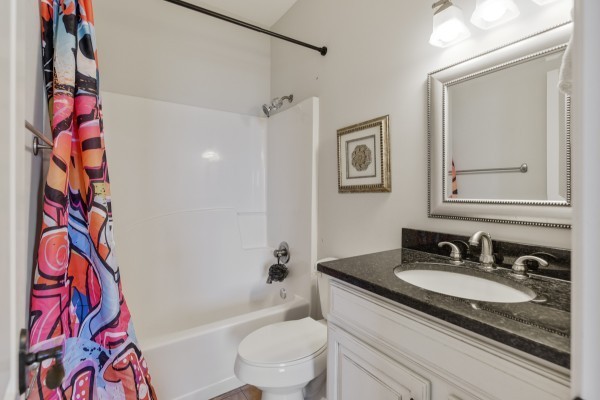 2228 B Highway 25 Cottontown, TN 37048 - Photo 47 of 61 a bathroom with a granite countertop sink toilet mirror vanity and shower