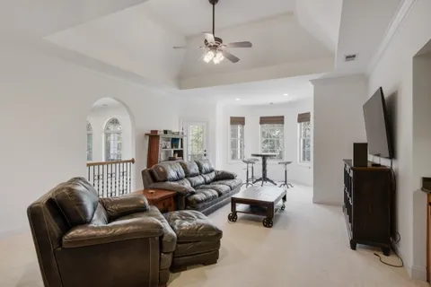 a view of a patio with wooden floor chairs and a table