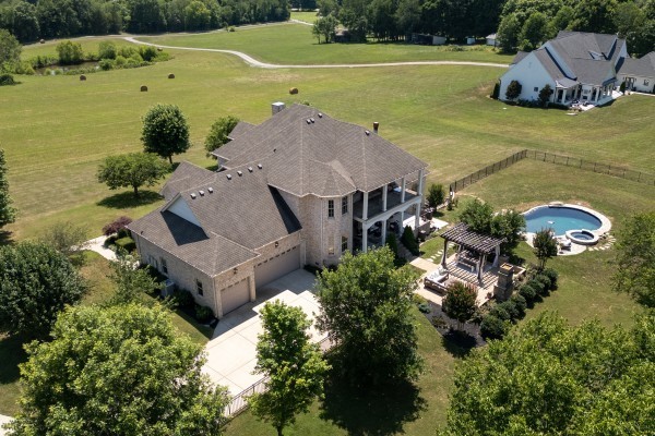 2228 B Highway 25 Cottontown, TN 37048 - Photo 55 of 61 an aerial view of a house with a garden and lake view