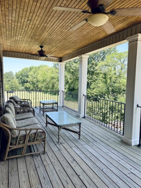 2228 B Highway 25 Cottontown, TN 37048 - Photo 59 of 61 a balcony with wooden floor and outdoor seating