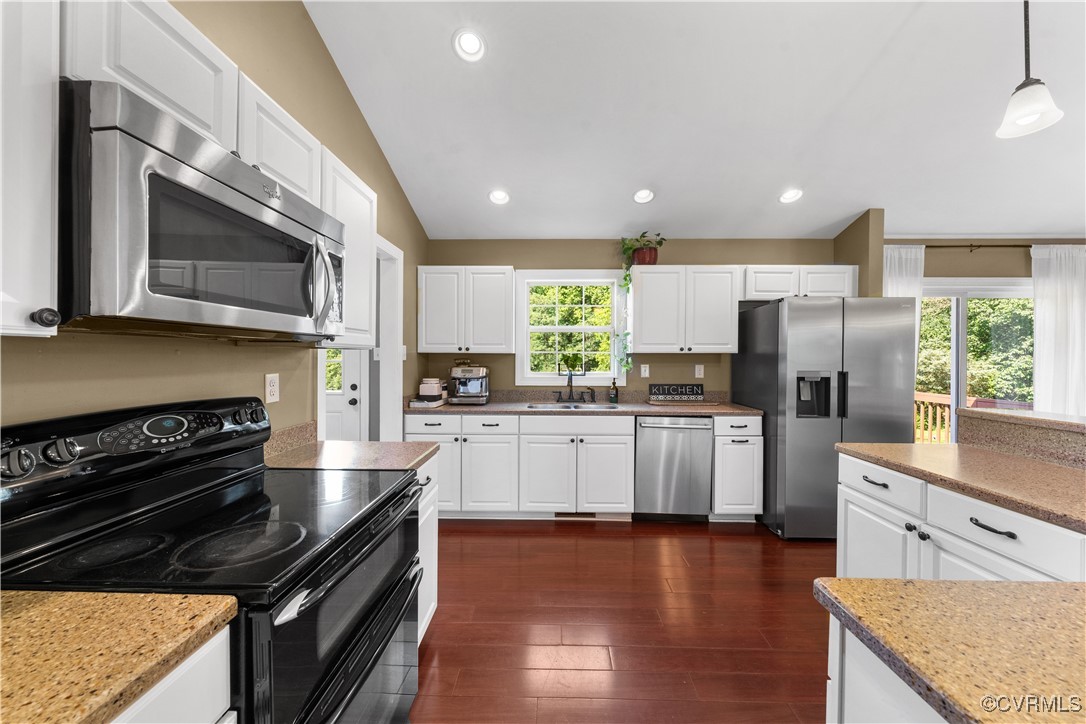201 School Road Dillwyn, VA 23936 - Photo 12 of 48 a kitchen with stainless steel appliances kitchen island granite countertop a stove a sink and a microwave