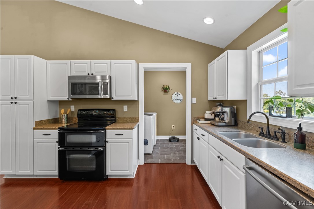 201 School Road Dillwyn, VA 23936 - Photo 15 of 48 a kitchen with kitchen island granite countertop a sink cabinets and stainless steel appliances