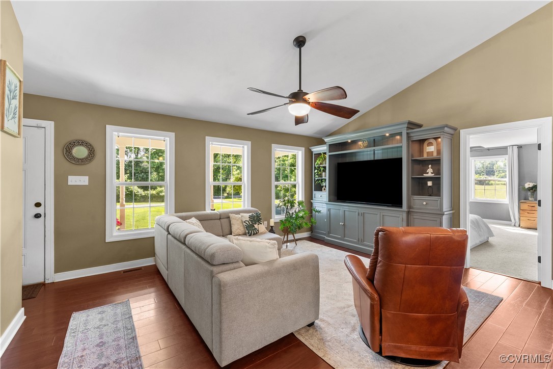 201 School Road Dillwyn, VA 23936 - Photo 16 of 48 a living room with furniture a flat screen tv and a large window