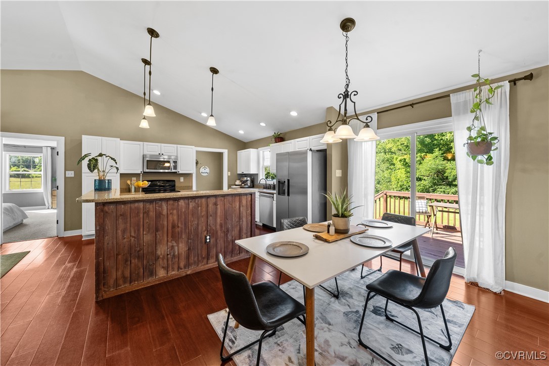 201 School Road Dillwyn, VA 23936 - Photo 18 of 48 a view of a dining room and livingroom with furniture wooden floor a chandelier