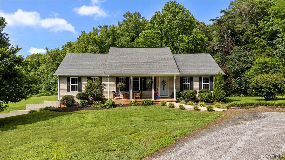 201 School Road Dillwyn, VA 23936 - Photo 2 of 48 a front view of a house with garden and trees