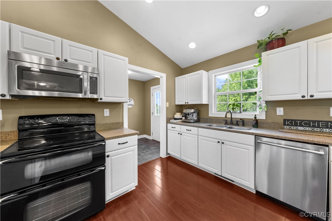 201 School Road Dillwyn, VA 23936 - Photo 21 of 48 a kitchen with stainless steel appliances a stove microwave and cabinets