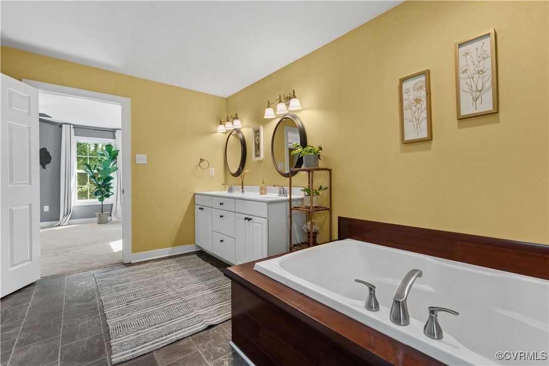 201 School Road Dillwyn, VA 23936 - Photo 26 of 48 a bathroom with a tub sink and mirror