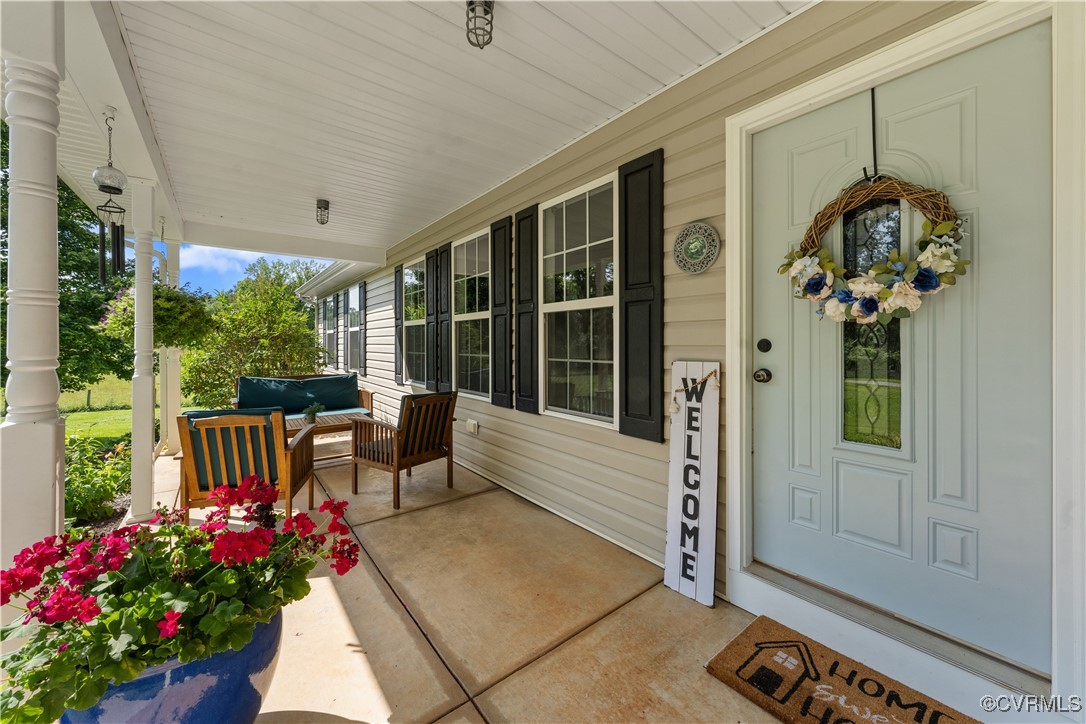 201 School Road Dillwyn, VA 23936 - Photo 4 of 48 a front view of a house with a porch