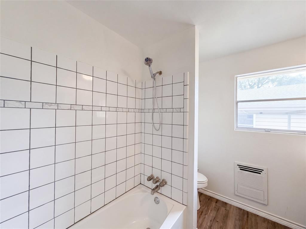 205 West Decatur Street Chico, TX 76431 - Photo 16 of 19 a bathroom with a bathtub and a shower