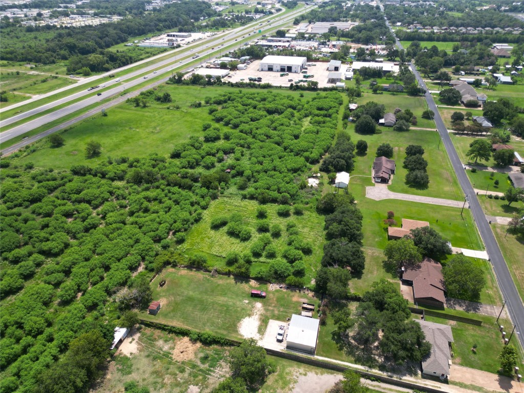 a view of a garden with a building