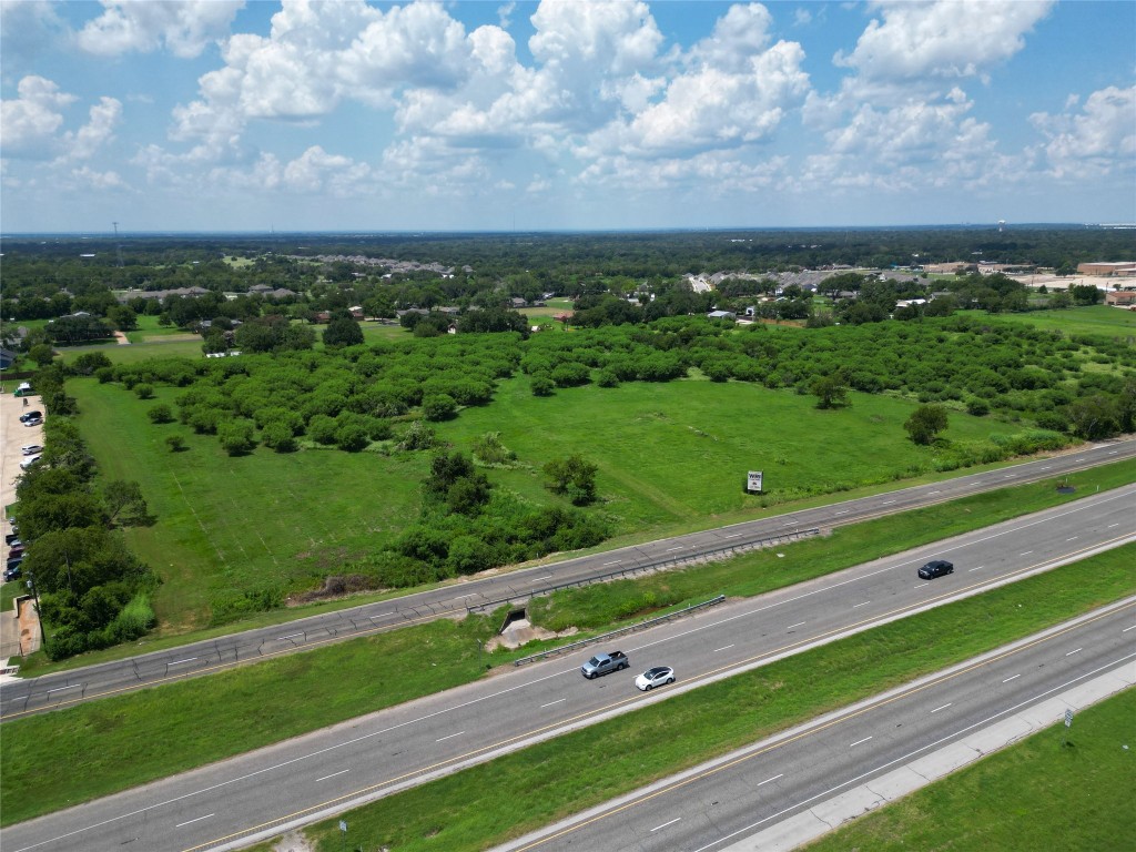 0 North N Highway Bryan, TX 77803 - Photo 4 of 6 a view of a city street both side of grassy field