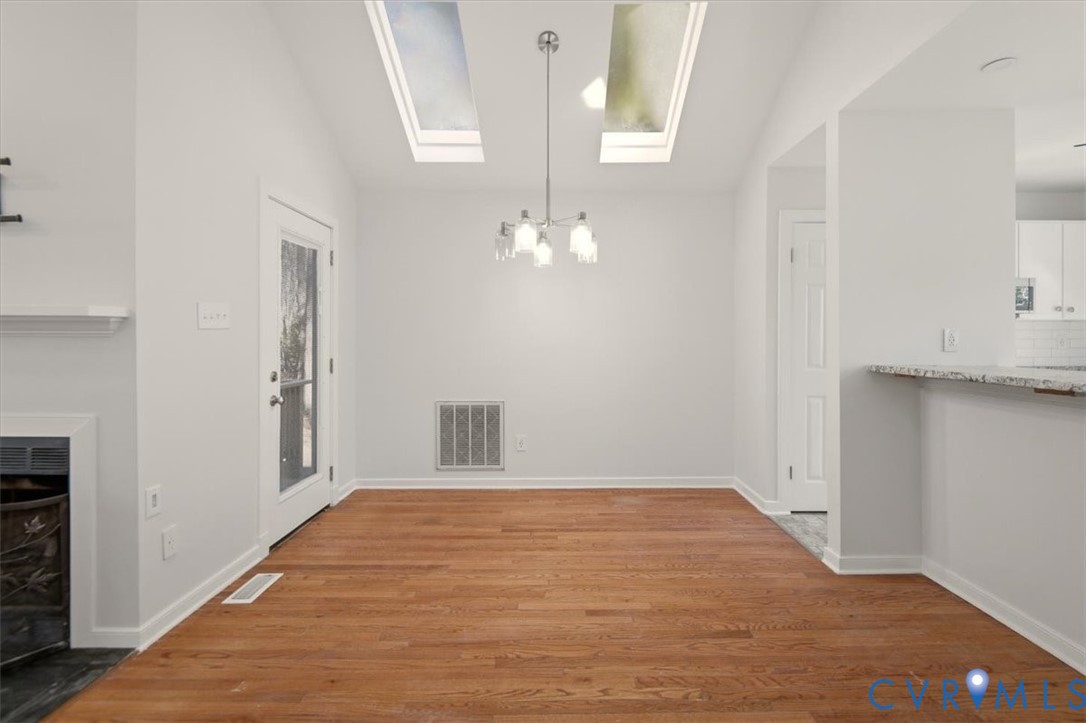 5600 Woods Walk Road Midlothian, VA 23112 - Photo 12 of 44 a view of a room with wooden floor and staircase