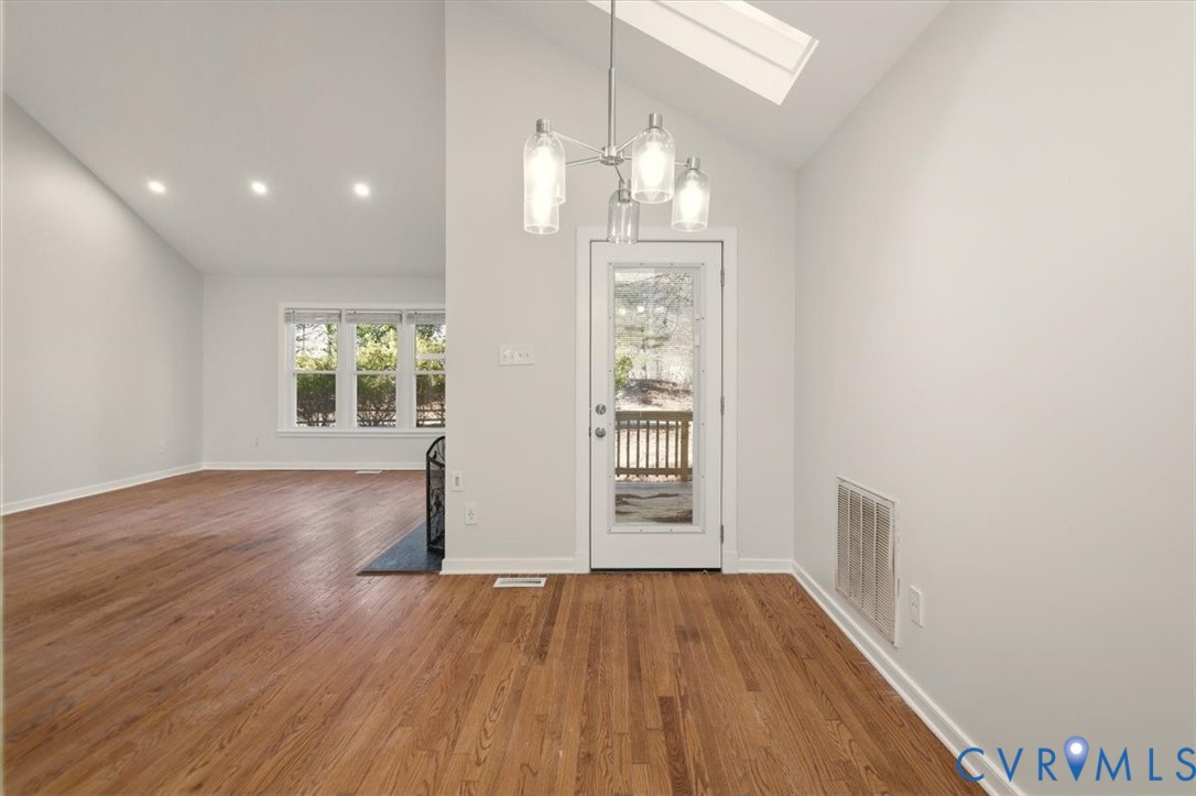 5600 Woods Walk Road Midlothian, VA 23112 - Photo 14 of 44 an empty room with wooden floor and windows