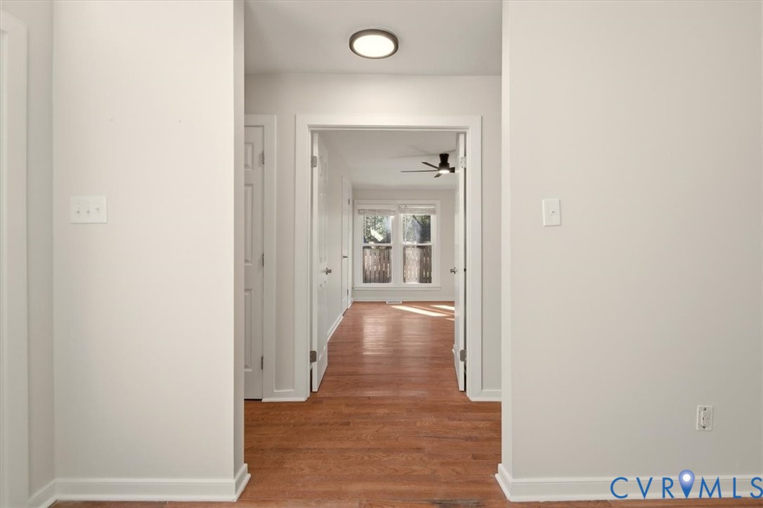 5600 Woods Walk Road Midlothian, VA 23112 - Photo 21 of 44 a view of a hallway with wooden floor