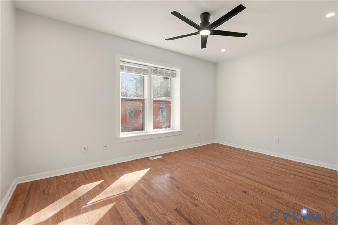 5600 Woods Walk Road Midlothian, VA 23112 - Photo 27 of 44 an empty room with a window and a ceiling fan