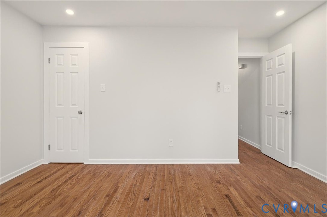 5600 Woods Walk Road Midlothian, VA 23112 - Photo 30 of 44 a view of an empty room with wooden floor