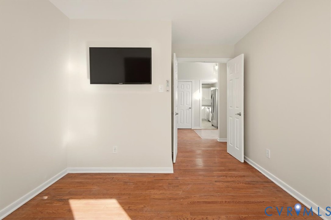5600 Woods Walk Road Midlothian, VA 23112 - Photo 32 of 44 a view of a livingroom with wooden floor