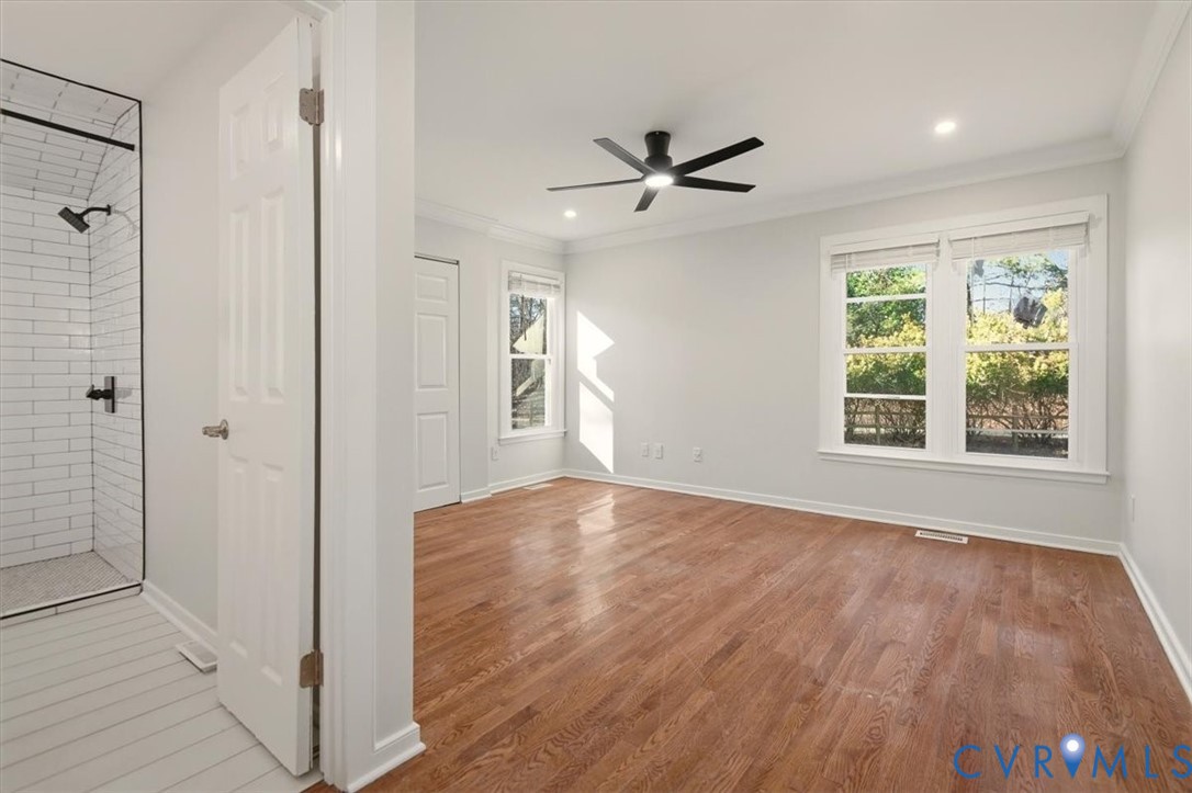 5600 Woods Walk Road Midlothian, VA 23112 - Photo 34 of 44 a view of an empty room with wooden floor and a window
