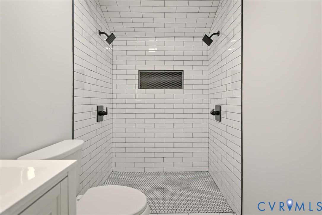 5600 Woods Walk Road Midlothian, VA 23112 - Photo 39 of 44 a bathroom with a toilet and a sink