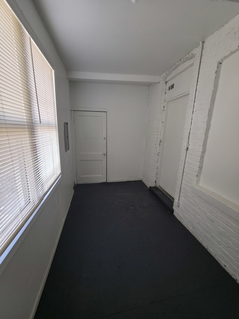 1748 North Keystone Avenue Chicago, IL 60639 - Photo 11 of 33 a view of small space with wooden floor and windows
