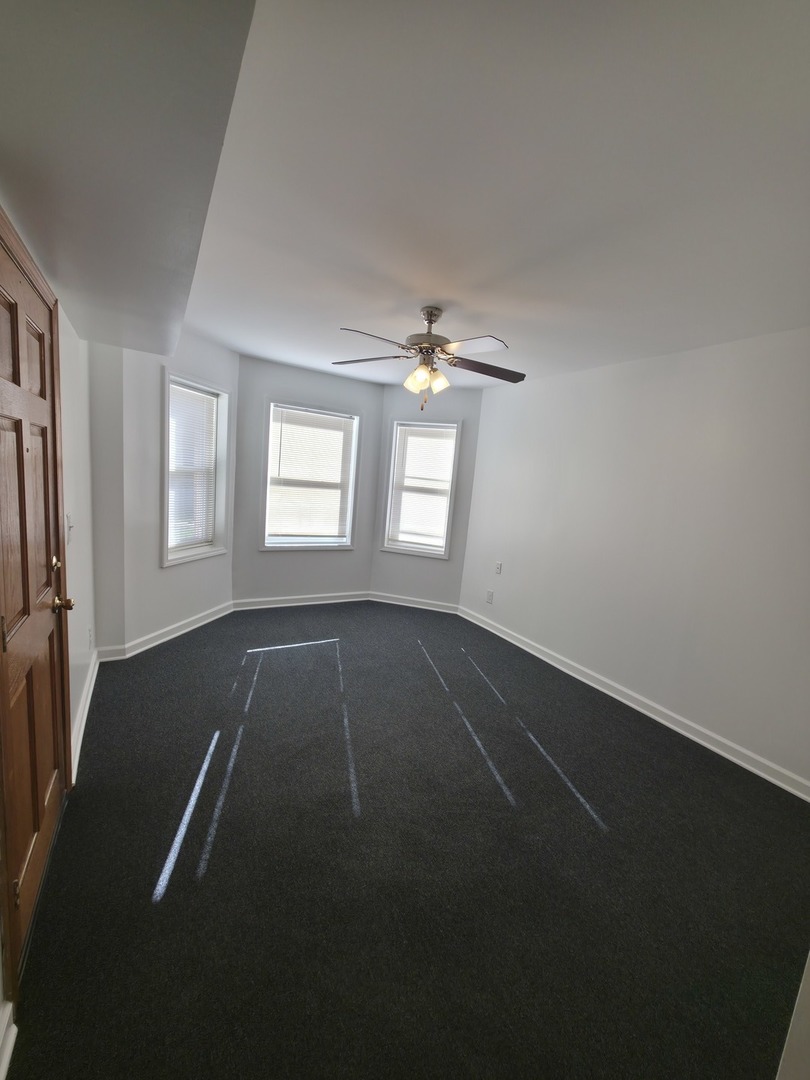 1748 North Keystone Avenue Chicago, IL 60639 - Photo 28 of 33 an empty room with windows