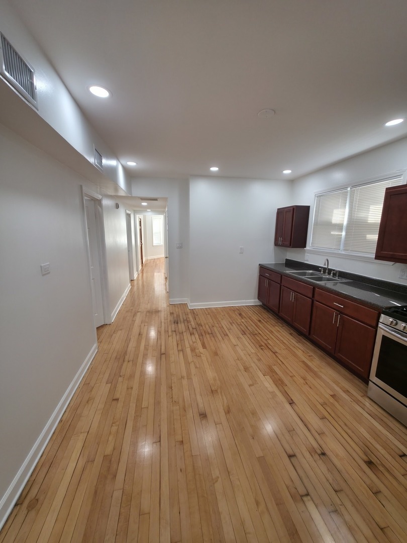 1748 North Keystone Avenue Chicago, IL 60639 - Photo 3 of 33 a view of kitchen with wooden floor