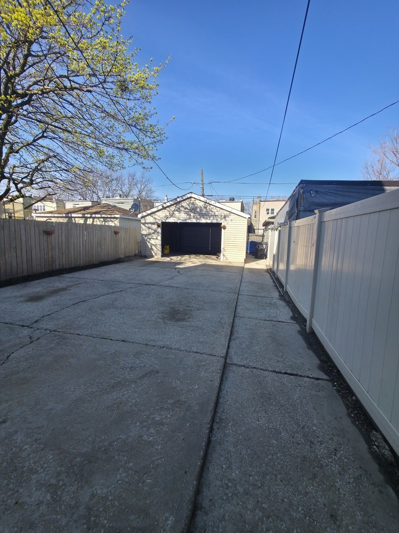 1748 North Keystone Avenue Chicago, IL 60639 - Photo 32 of 33 a view of an empty room with a kitchen