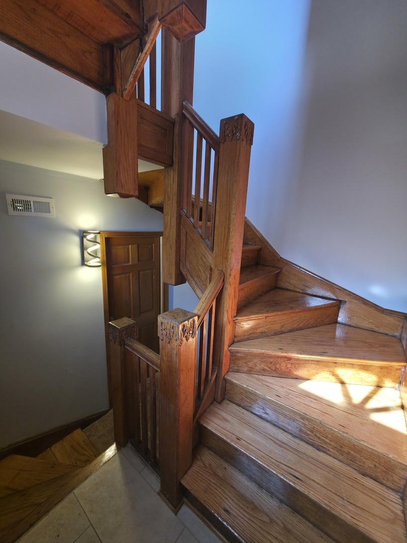 1748 North Keystone Avenue Chicago, IL 60639 - Photo 33 of 33 a view of staircase with wooden floor and stairs