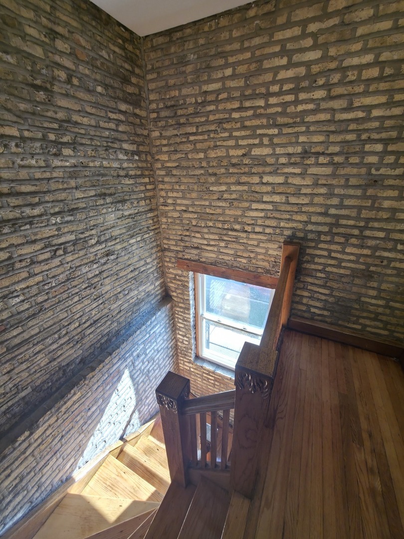 1748 North Keystone Avenue Chicago, IL 60639 - Photo 10 of 33 a view of balcony with wooden floor