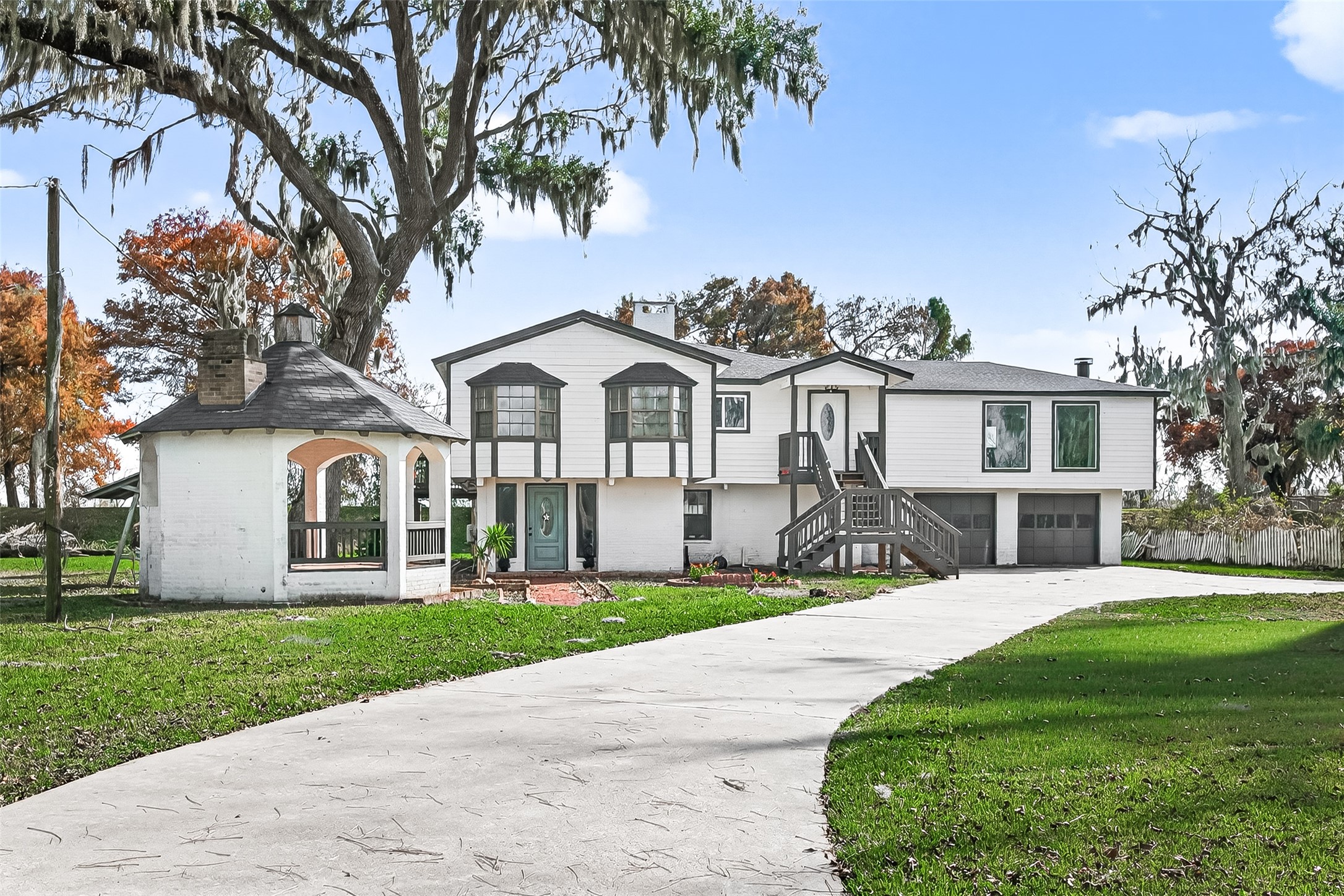 29927 County Road 25 Damon, TX 77430 - Photo 1 of 43 a front view of a house with a garden and trees