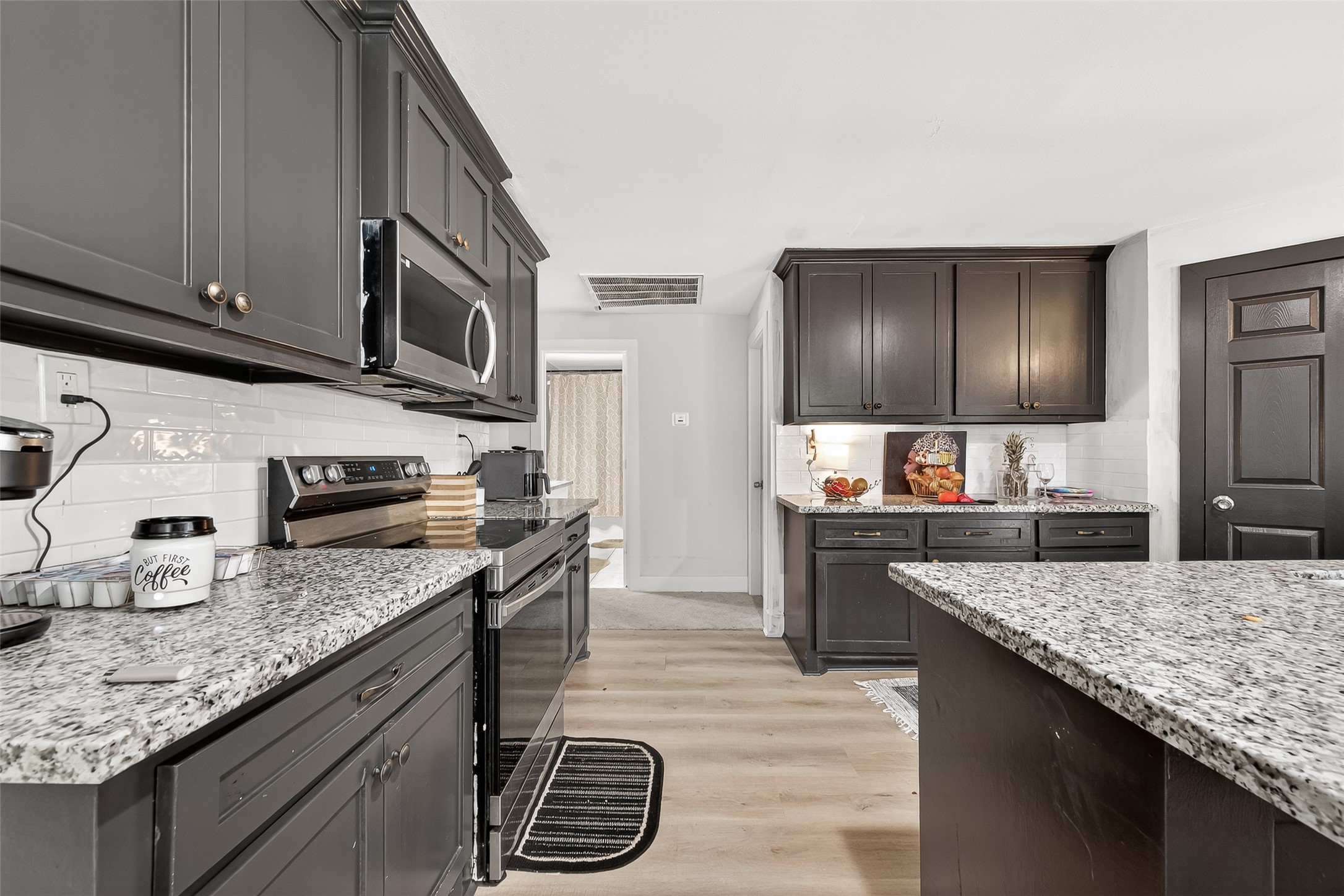 29927 County Road 25 Damon, TX 77430 - Photo 12 of 43 a kitchen with stainless steel appliances granite countertop a sink and stove
