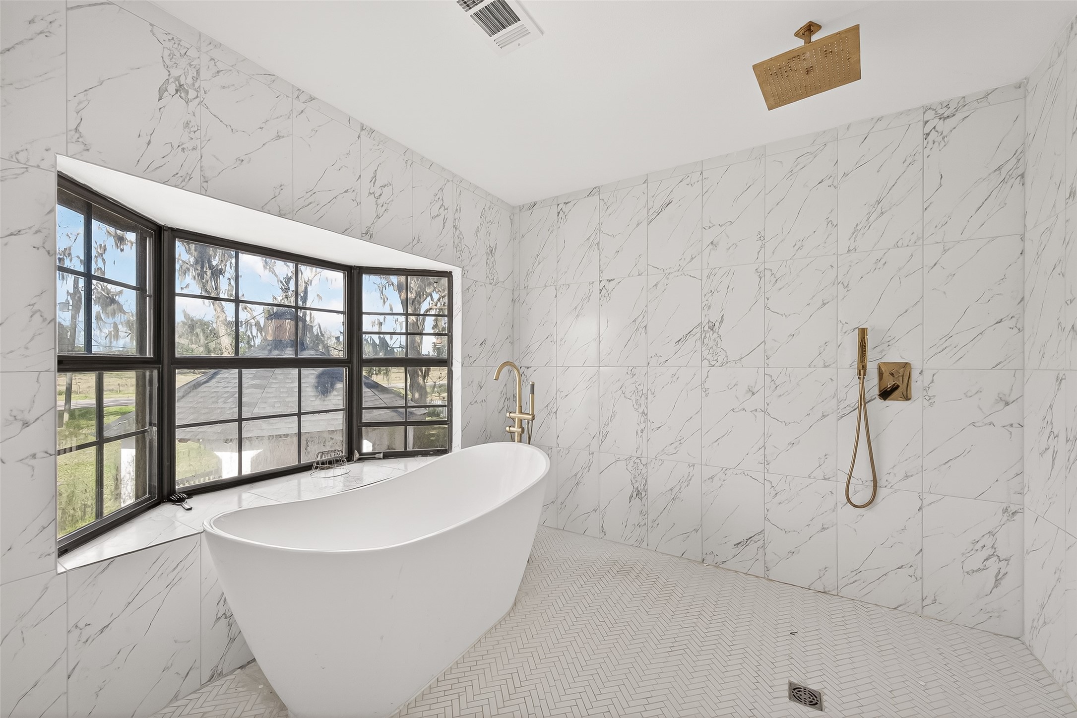 29927 County Road 25 Damon, TX 77430 - Photo 17 of 43 a bathroom with a bathtub and a shower