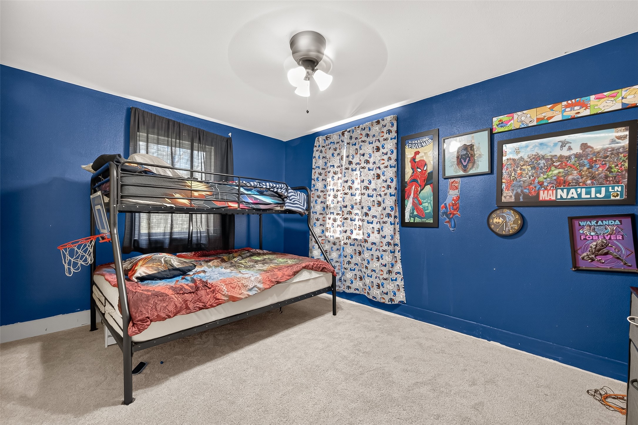 29927 County Road 25 Damon, TX 77430 - Photo 19 of 43 a bedroom with a bed and a bookshelf